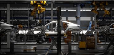 Car on robotic welding line. Automated production line in a car plant. 3d Rendering,