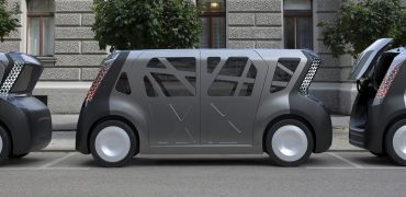 Steel E-Motive cars in a row - doors and rear hatch open