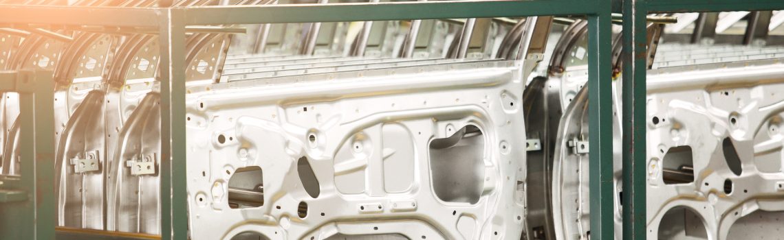 Image of stamped steel doors in an automotive production environment